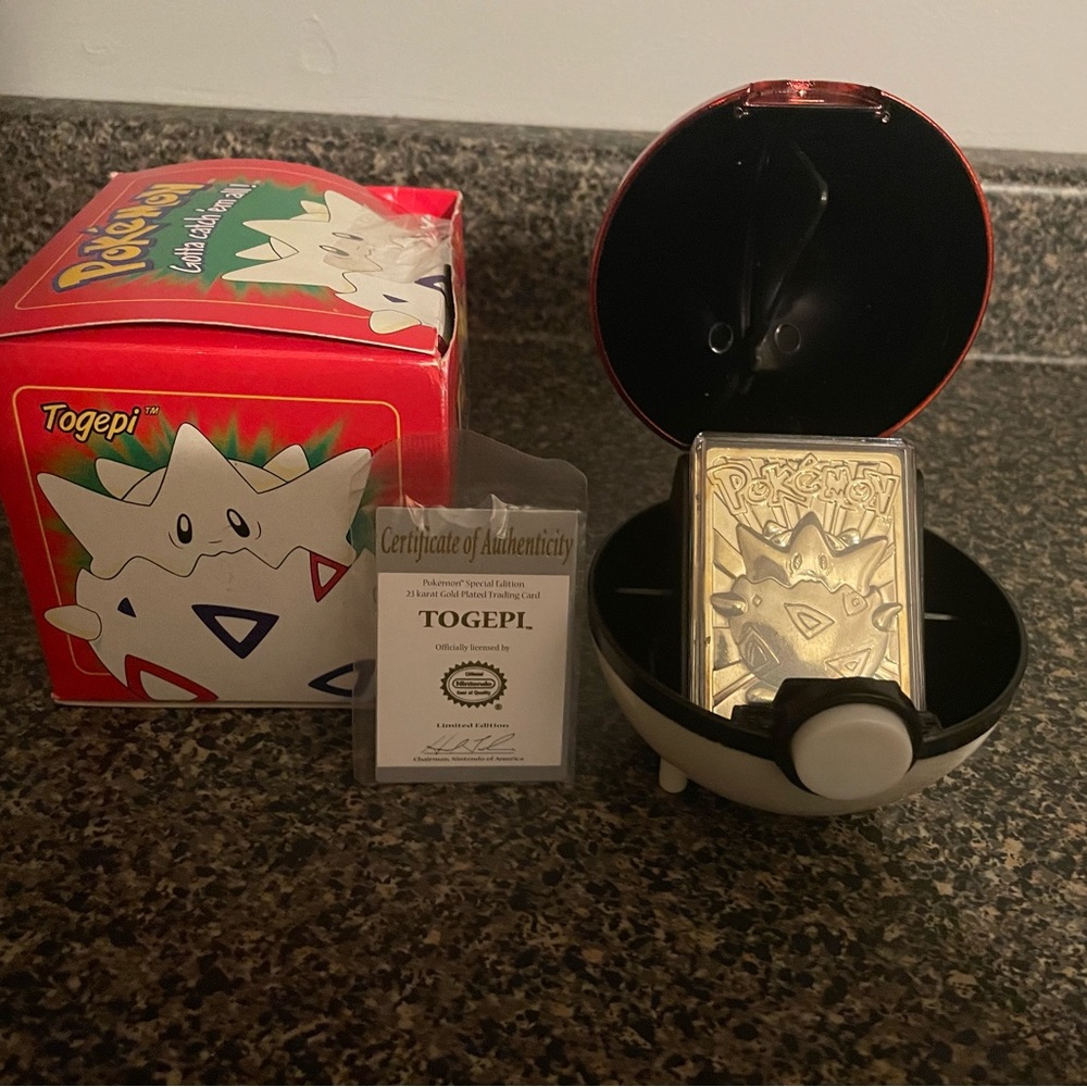 Pokémon gold platted poke ball with authenticity card